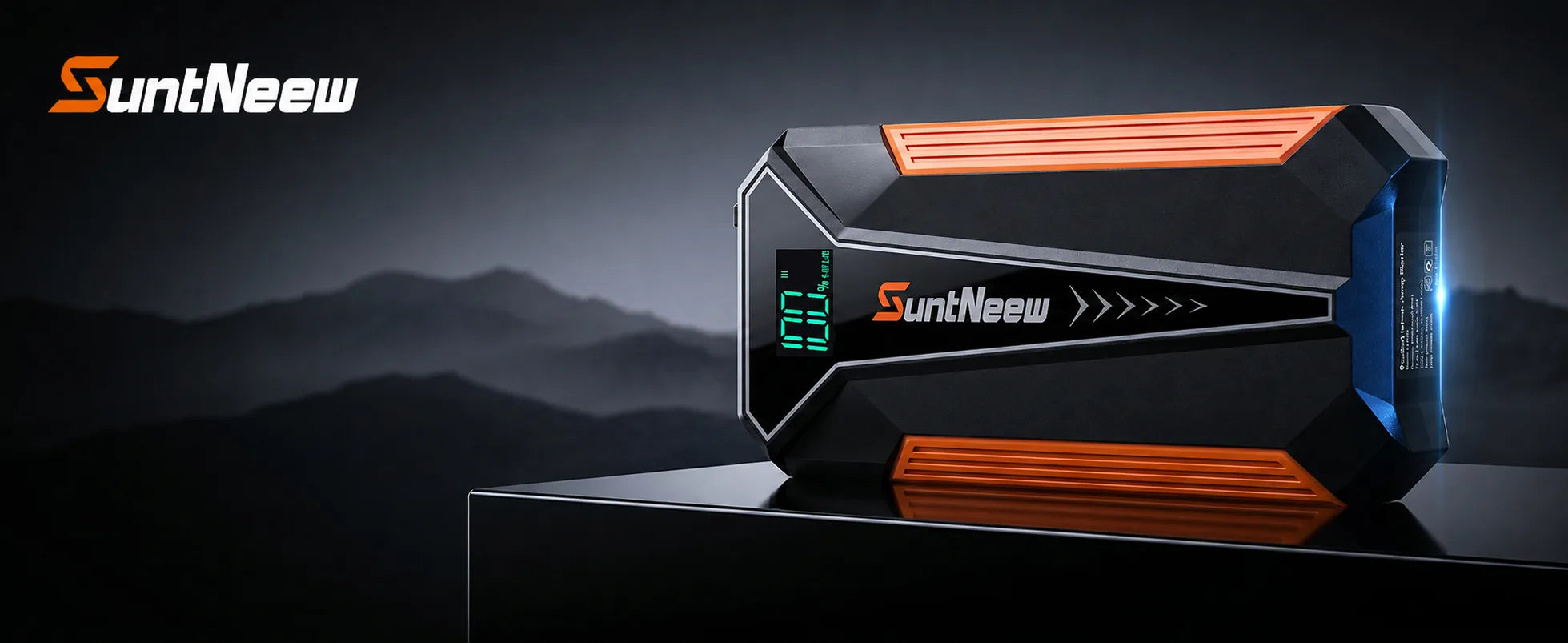 SuntNeew A20 orange jump starter on a dark platform